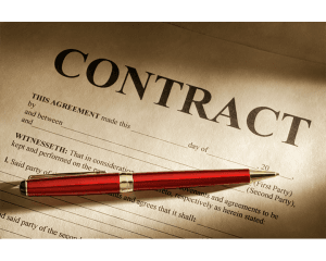 pen laying on paper that says contract